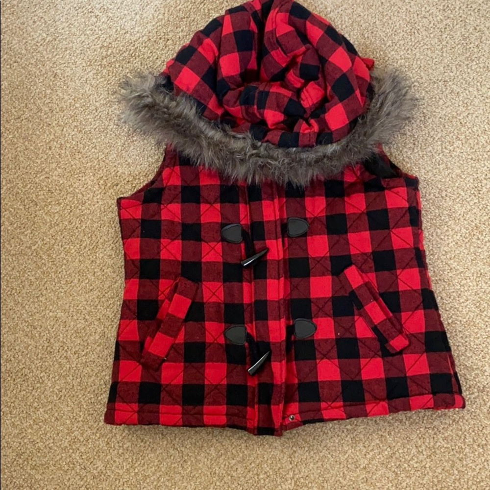 Women’s flannel vest with fur rimed hood.